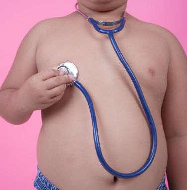 obese-boy-who-is-overweight-on-pink-background